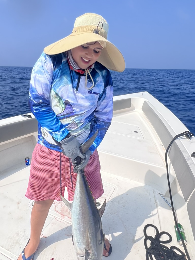 Offshore. The hat was bigger than the boy.